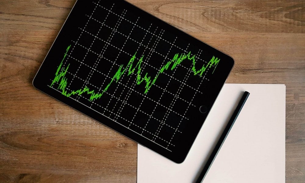 space grey ipad air with graph on brown wooden table 187041 scaled