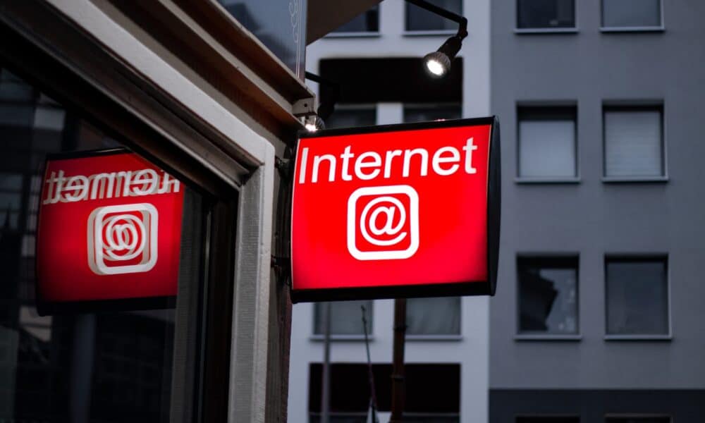 Internet LED signage beside building near buildings