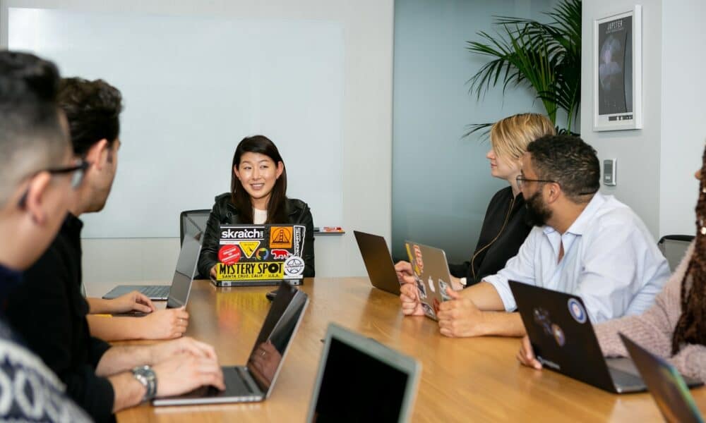 people in a meeting discussing app development