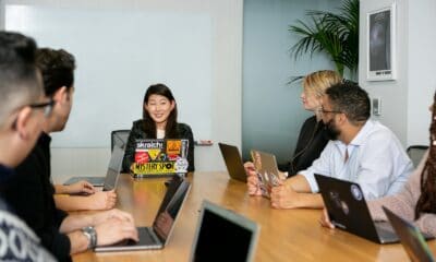people in a meeting discussing app development