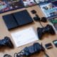 black sony ps 4 game controller on brown wooden table