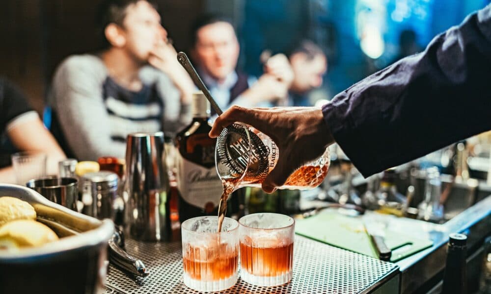 man pouring drink