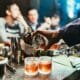 man pouring drink