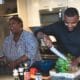 man slicing vegetable