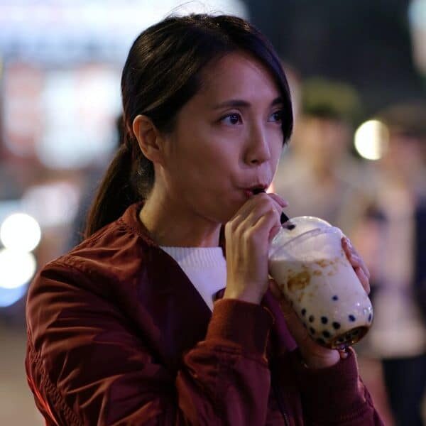woman drink of taiwan iced bubble tea in the night market e1650958029302 pnx8to4hzkdtpy4lwogsr5vo9i8f6w2ah0izeke8a8