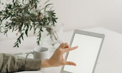 Person Holding White Tablet Computer