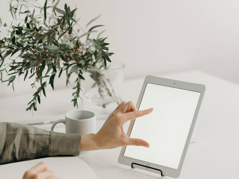 Person Holding White Tablet Computer