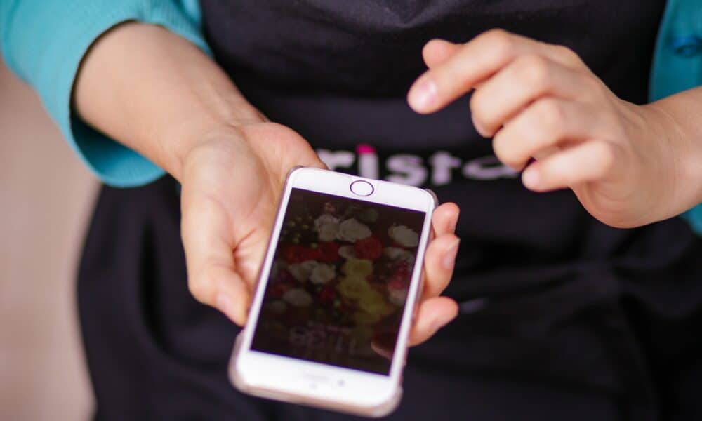 Person Holding White Iphone 5
