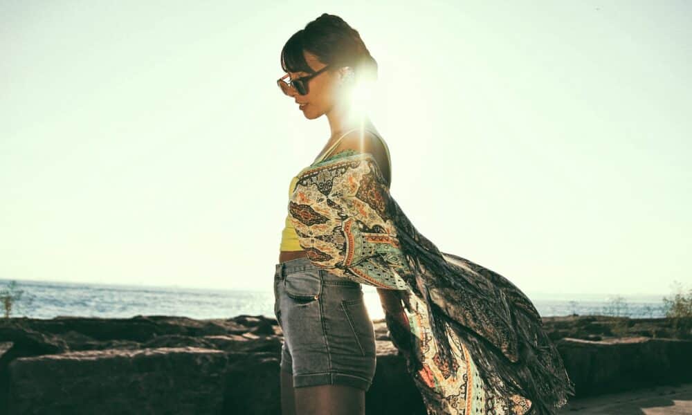 woman wearing beige and black paisley top