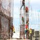 people working on building during daytime