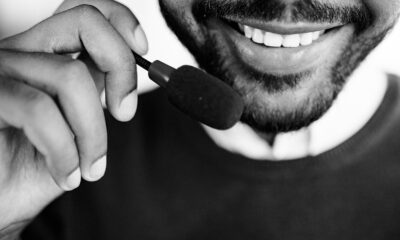 Grayscale Photo of Person Smoking
