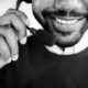 Grayscale Photo of Person Smoking
