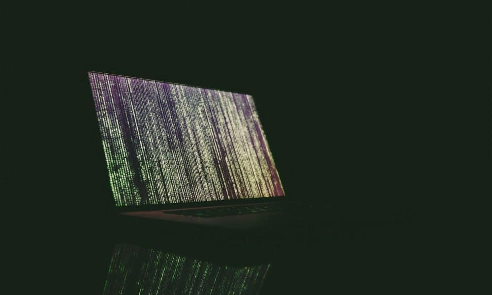 turned on laptop on table