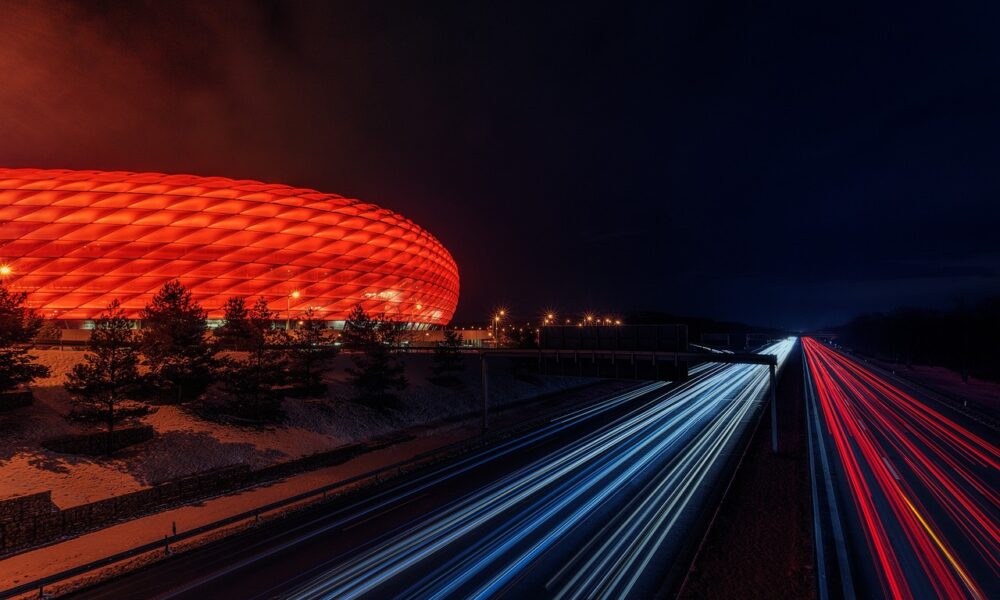 football stadium, highway, night