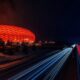 football stadium, highway, night