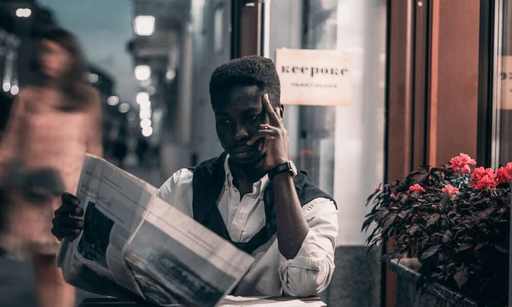 Black Man Reading a Newspaper