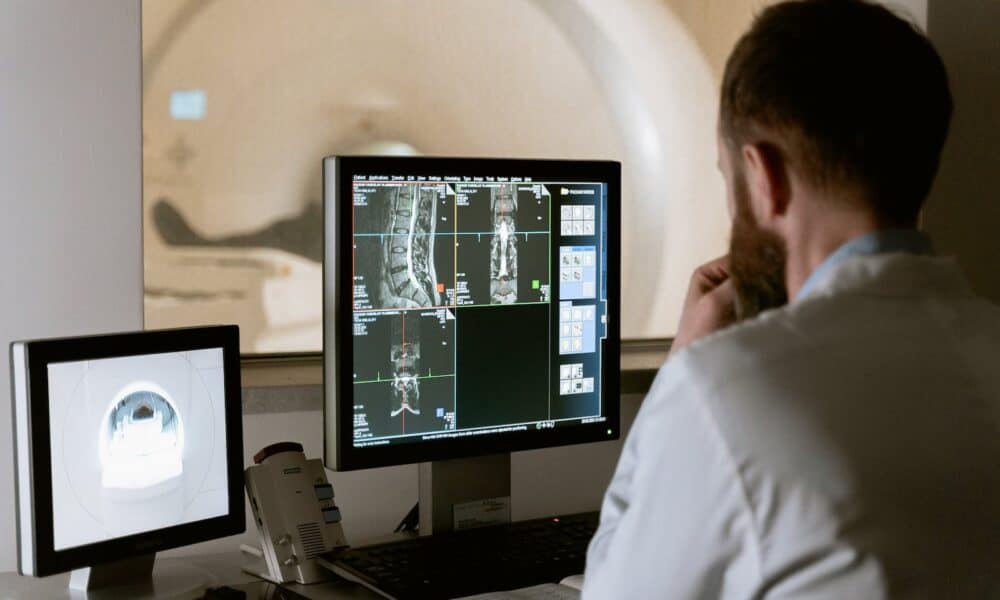 Photo Of Doctor Looking Deeply Unto The Screen