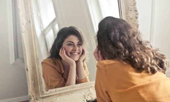 Photo of Woman Looking at the Mirror