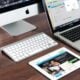 Turned on Imac Beside Macbook on Table