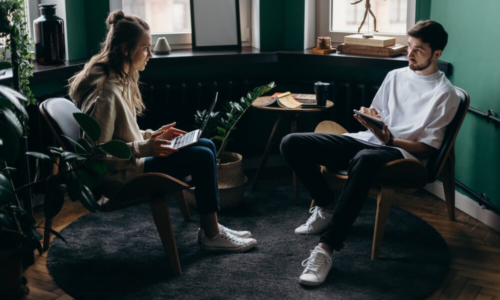 Photo of Man and Woman Talking to Each Other