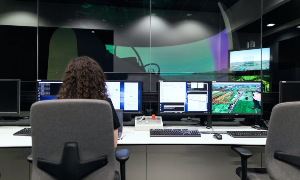Female Engineer Controlling Flight Simulator