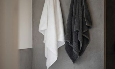 white bath towel on white ceramic bathtub