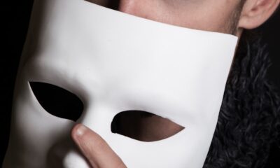 man with white face mask