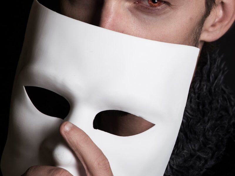 man with white face mask