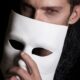 man with white face mask