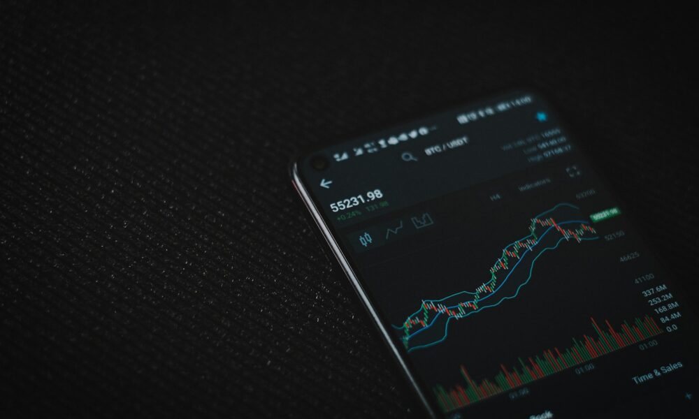 black android smartphone on black textile