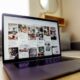 black laptop computer on brown wooden table