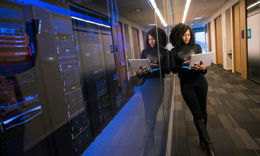 woman in black top using Surface laptop