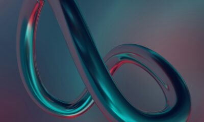 a blue and red object with a long curved tail