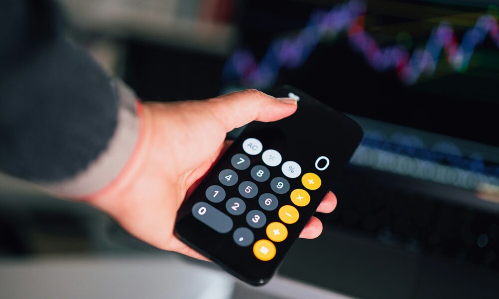 a person holding a remote control in their hand