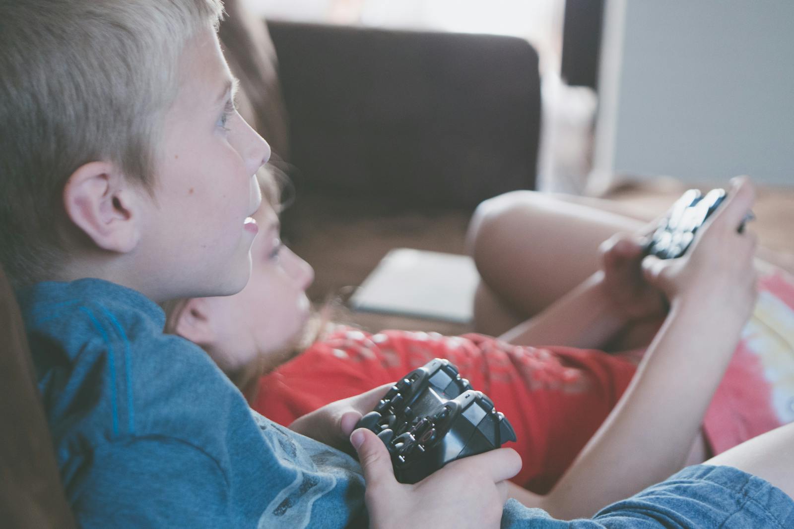 Flashpoint Codes: Active List & Redeem Guide 16 Two children playing video games together with controllers indoors.