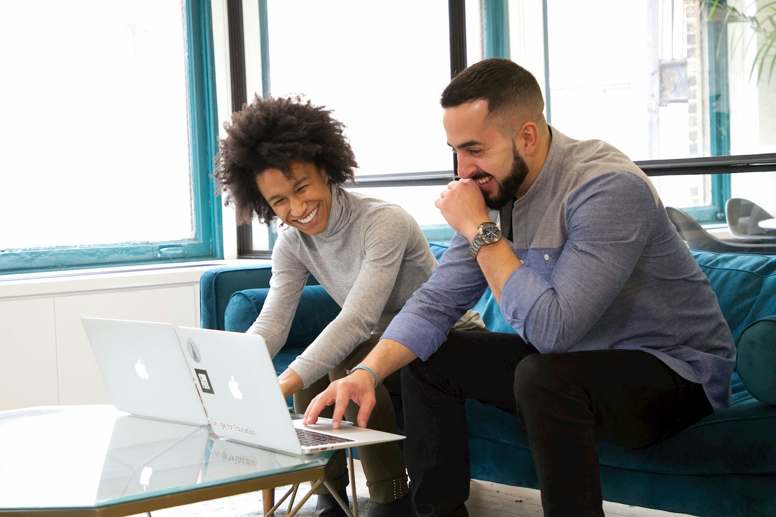 How to Turn Down a Job Offer But Keep the Door Open Professionally 17 a man and woman sitting on a couch looking at a laptop