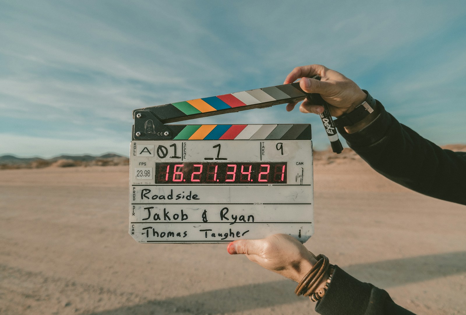 AI Video Enhancer to Improve Video Quality 16 clap board roadside Jakob and Ryan