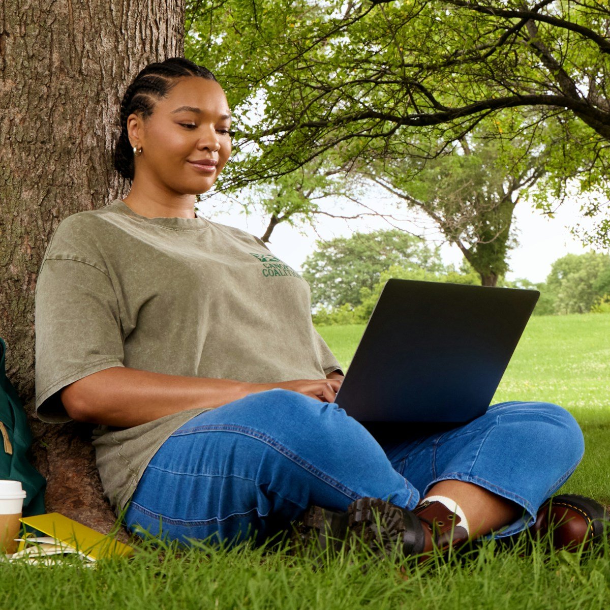 WindGustNews: Your Essential Source for Real-Time Weather Updates 16 Woman using laptop while sitting under a tree