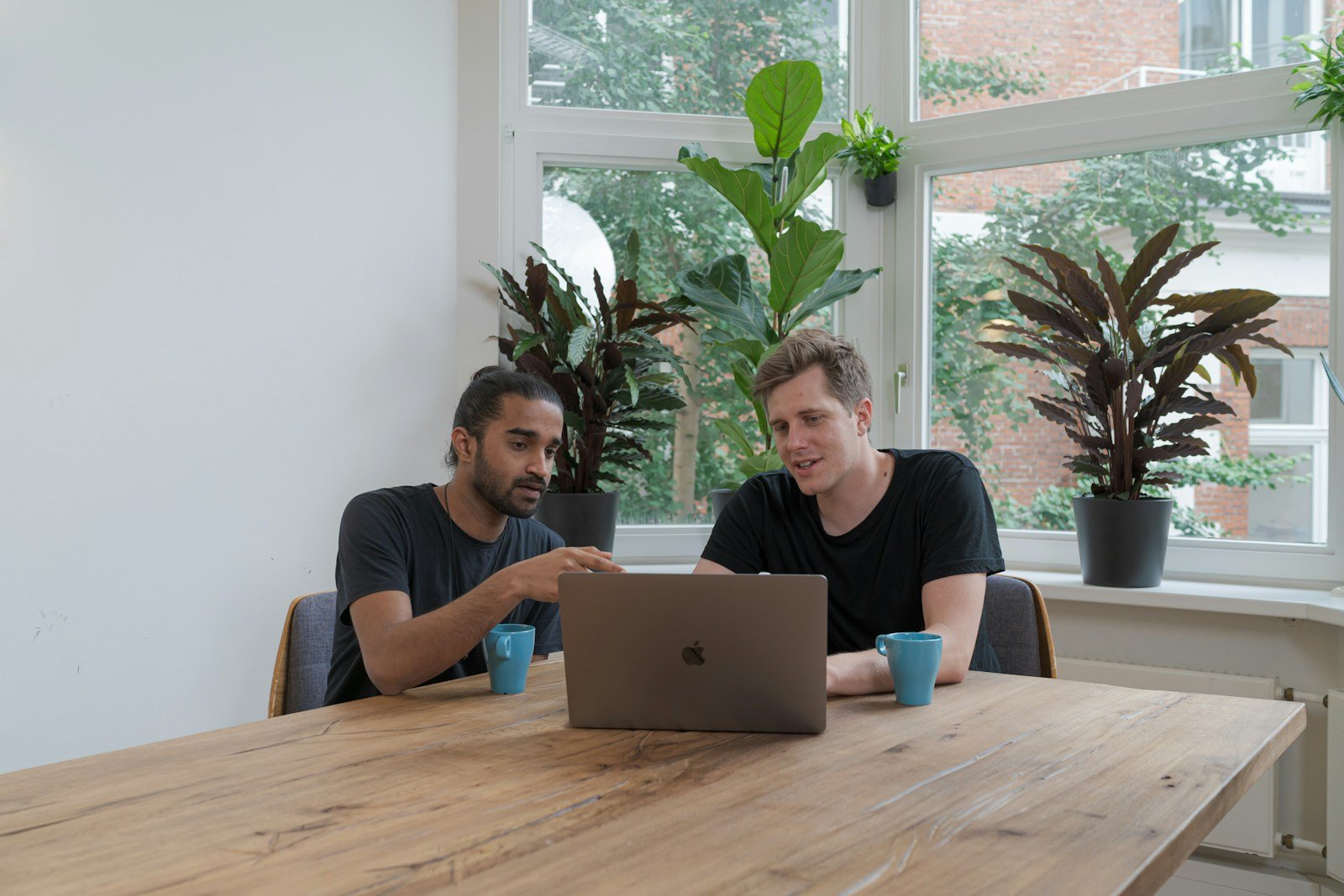 SaaS Marketing in 2025 – How Startups Can Compete with Rising CAC 16 woman in blue crew neck t-shirt using silver macbook