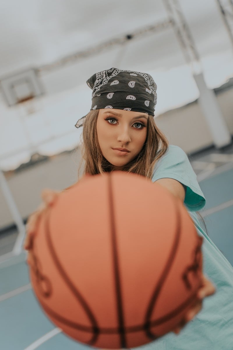 Liberty vs Wings: A Riveting WNBA Rivalry in Full Flight 16 a young woman holding a basketball on a basketball court