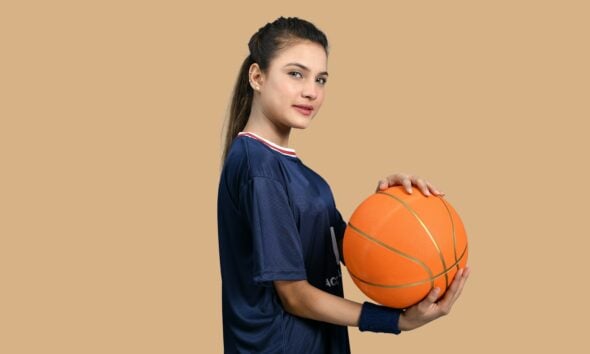a man holding a basketball