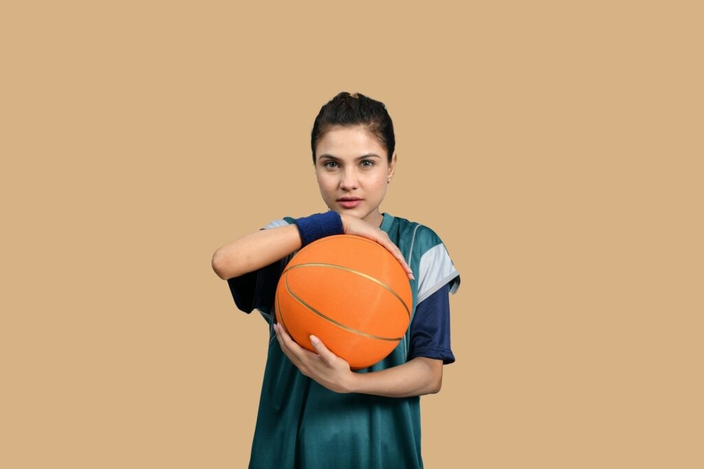 a person holding a basketball
