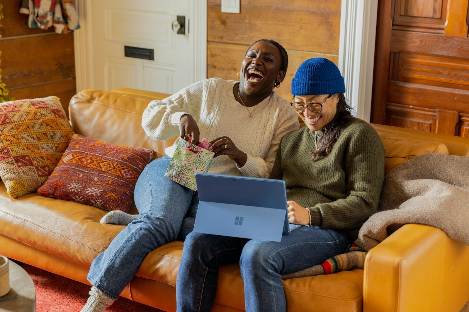 Unlock the Best Deals with an Etsy Coupon Code 16 a person sitting on a couch with a laptop