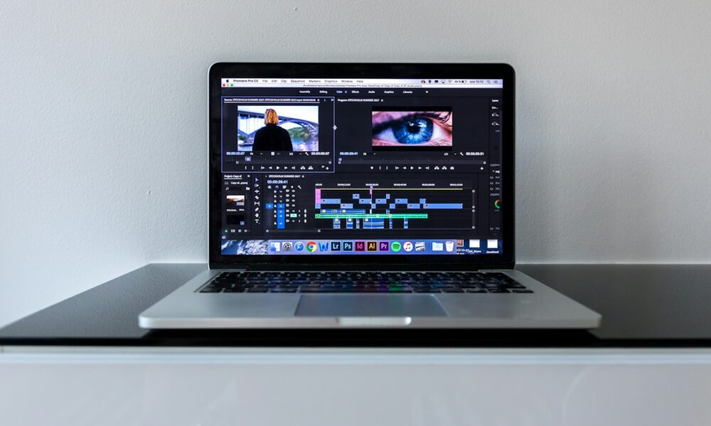 MacBook Pro on black desk