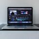 MacBook Pro on black desk
