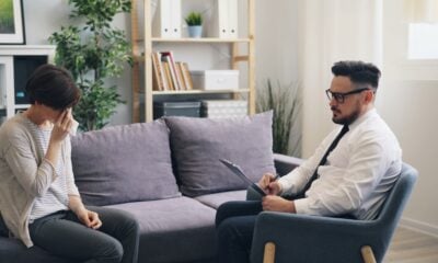 a man and a woman sitting on a couch