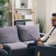 a man and a woman sitting on a couch