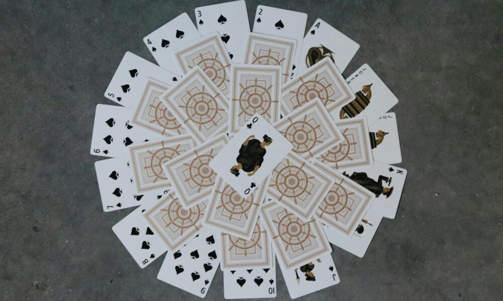 a group of playing cards sitting on top of a floor