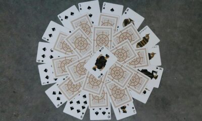 a group of playing cards sitting on top of a floor