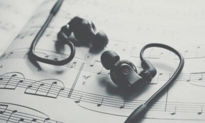 black earbuds on white paper